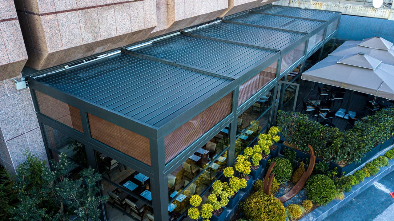 Restaurant terrace with bioclimatic louvered roofs, seen from above