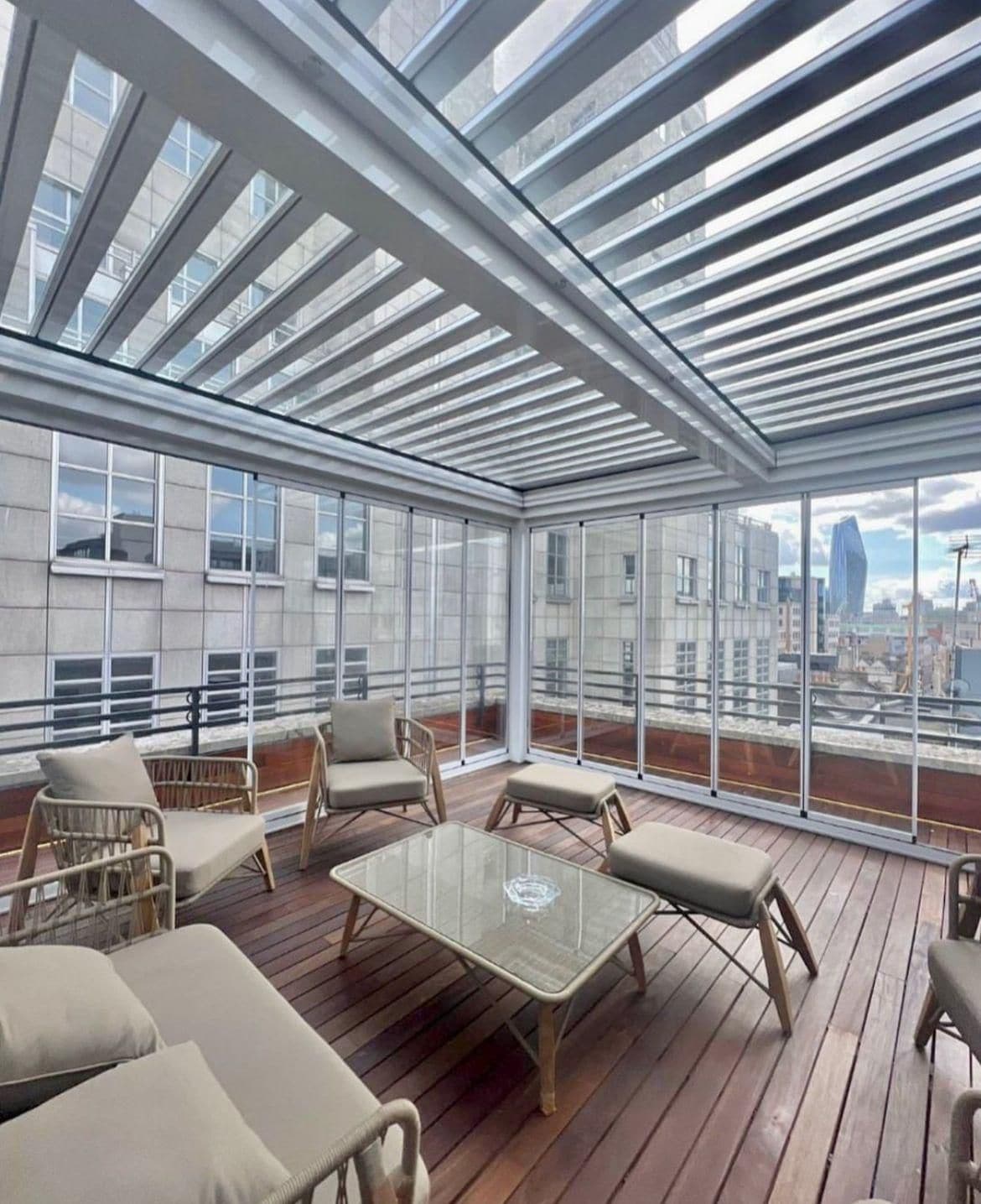 Glass enclosure framing a rooftop view