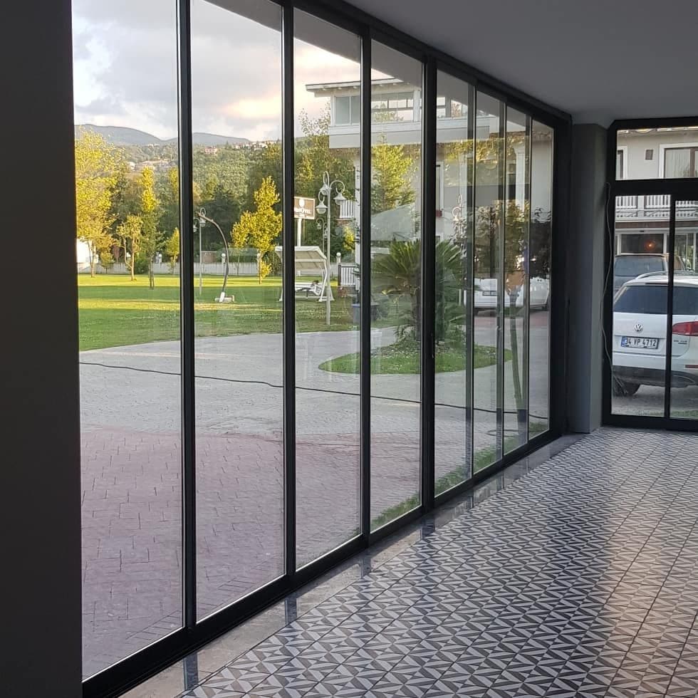 Floor-to-ceiling sliding glass panels